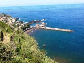 The praia do porto do seixal beach is a black sand beach. Seixal Harbor Beach in Porto Moniz, Madeira | Beaches
