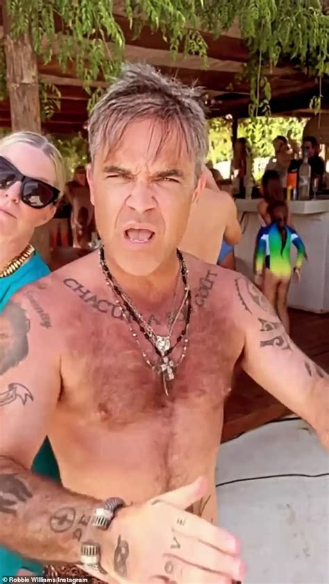 Robbie Williams Dances To Classic Abba Tune In His Swimming Trunks As He Enjoys Ibiza Sound