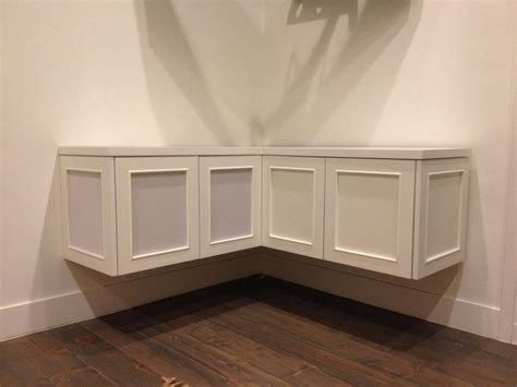 Corner cabinets can add storage and display space in any room without being too intrusive to the corner cabinets are sometimes on some legs or sometimes can be stuck to the wall floating off the. Beige Stained Wood Floating Corner Media Cabinet With ...