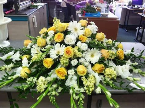Buy funeral flowers online from ferns n petals to express sympathy. White and yellow casket spray | Funeral flowers, Funeral ...