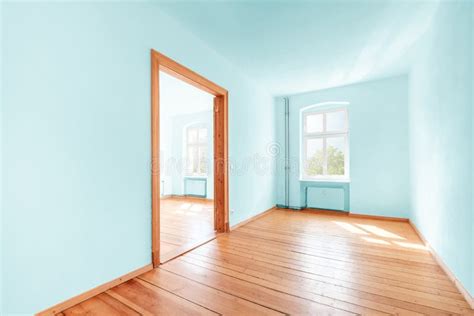 Empty Room In Renovated Flat With Green Painted Walls Stock Photo
