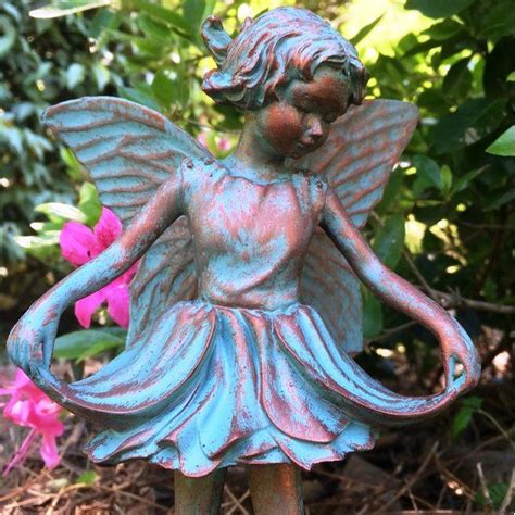 Teresa's collections large fairy garden statue with solar powered lights, outdoor fairy garden figurines sitting on mushroom yard art, ideal for garden,lawn,yard decorations 14inch tall. Suffolk Fairy Emily Statue | Statue, Garden statues ...