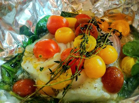 Baked cod is flakey and flavorful and so easy to make! Baked Cod, Tomatoes and Spinach in Foil Packets | savory