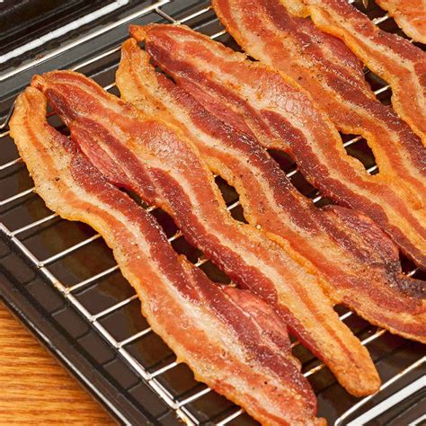 Lay the bacon on a sheet pan and bake for 15 to 20 minutes until the bacon is really crispy. How To Cook Bacon In The Oven | MyGourmetConnection