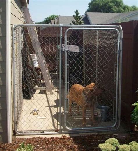 Pour the bag of concrete into the wheelbarrow. Should I Build or Buy a Dog Kennel Run? | PetHelpful
