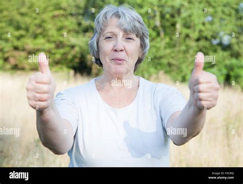 Old Age Woman Showing Thumbs Up With Both Hands Stock Photo Alamy
