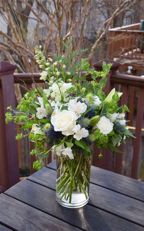 Tall Flower Arrangement With White Blooms And Touch Of Blue Thistle