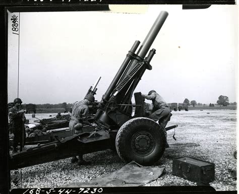 Cleaning And Removing The Breach Block Of A 155mm Howitzer After Firing