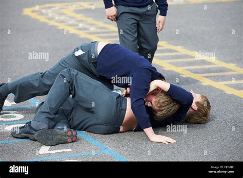Two Boys Fighting In School Playground Stock Photo Alamy