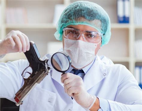 Forensics Investigator Working In Lab On Crime Evidence Stock Photo