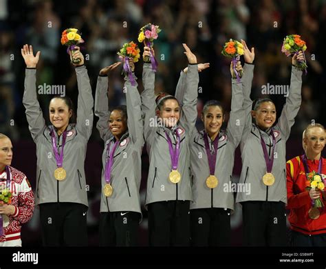 Usas Team Celebrate Winning The Gold Medal On The Podium During The Artistic Gymnastics Womens