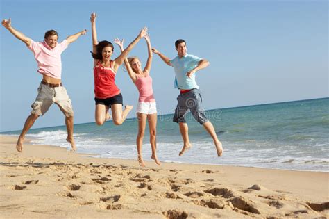 Group Of Friends Enjoying Beach Holiday In The Sun Royalty Free Stock ...