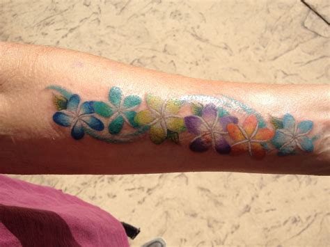 Maybe you would like to learn more about one of these? My new tattoo. Plumeria flowers with my 6 son's birthstone ...