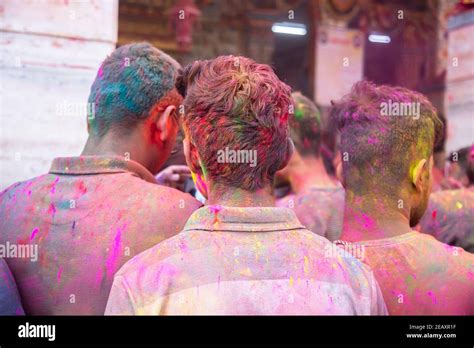 Indian People Covered With Colored Powder Celebrating Holi Festival