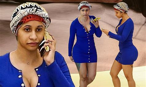 The new pics show cardi on her phone and possibly. Cardi B looks almost unrecognizable in a head-wrap and no ...