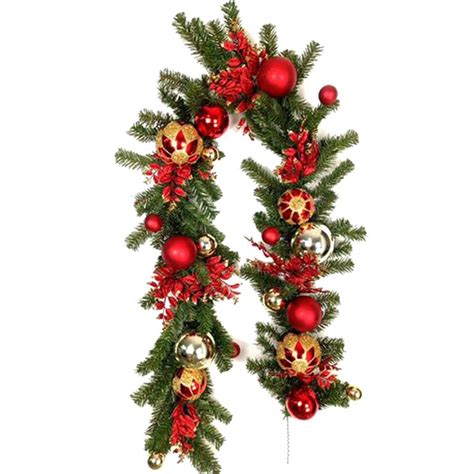 Take your coastal christmas decorations to new. Christmas Garland Decorated with glitter balls & ornaments ...