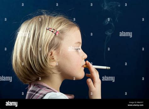 A Young Girl Smoking A Cigarette Stock Photo Royalty Free Image