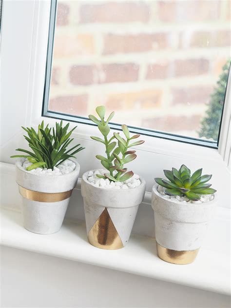 Make these pretty diy concrete planters with a cheap bag of concrete mix. Gold Concrete Succulent Planters DIY - Bang on Style
