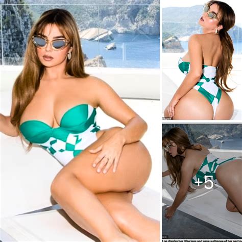 Demi Rose Flaunts Her Eye Popping Assets In A Strapless Green And White Swimsuit As She Frolics