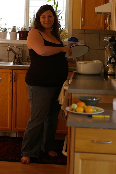 barefoot and pregnant in the kitchen captions trend today