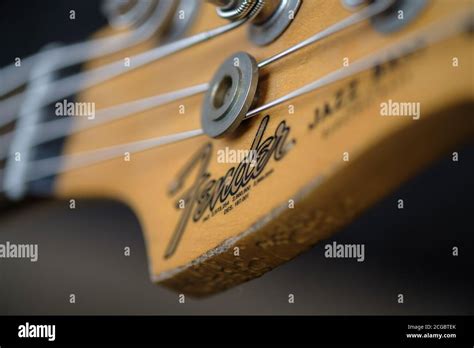 Headstock Of A Fender Jazz Bass Guitar With Fender Logo Stock Photo