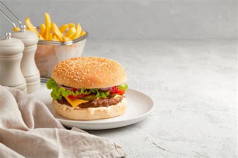 Fresh Tasty Burger French Fries And Ketchup On Gray Background Stock