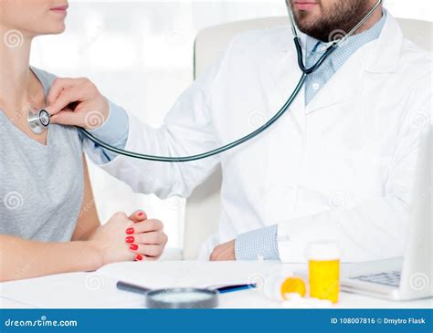 Doctor Listening To Patient Chest With Stethoscope Checking Heart Beat