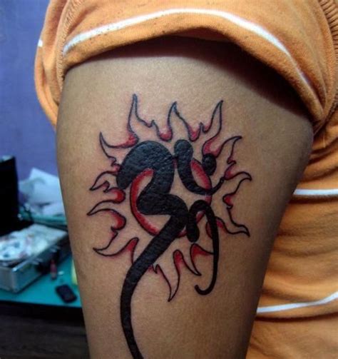 Om tattoos can be combined with many other tattoo designs which give a better finish to tattoo. Wonderful Om Symbol And Red Sun Tattoo Design On Bicep ...