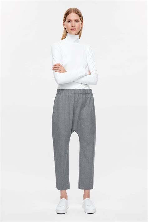 made from lightweight wool mix with a subtle textured finish these have a… drop crotch pants