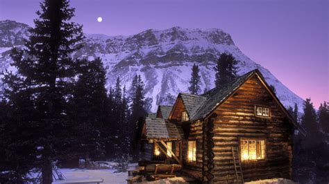 Download Enchanting Snowy Retreat Cozy Winter Cabin Wallpaper