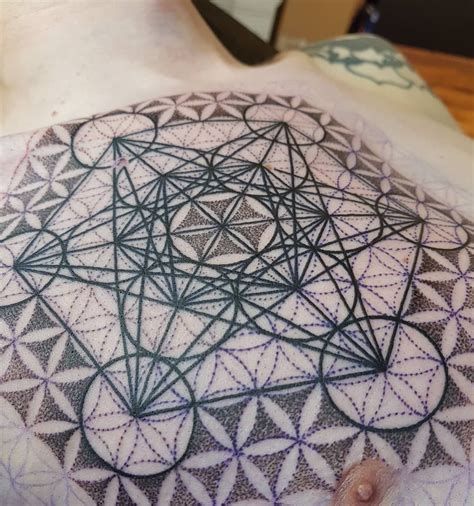 Leo zodiac sign between flower design on shoulder ideas for boys. #mandala #dotwork #metatron #floweroflife #tattoo ...