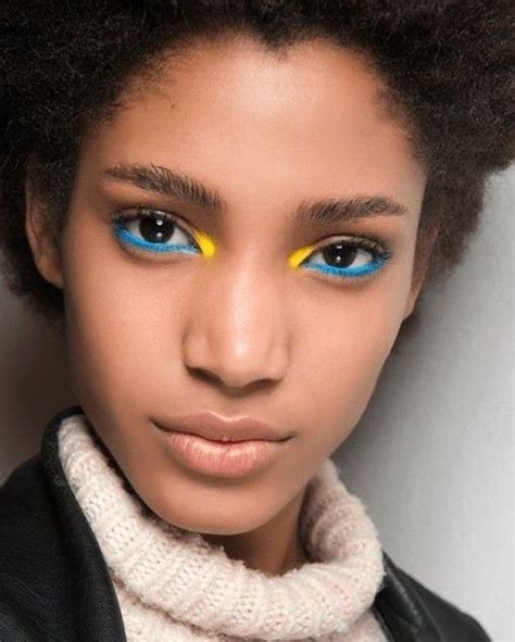A Woman With Bright Blue And Yellow Eyes