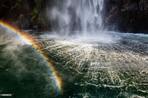 High Angle View Of Rainbow Over Waterfall Flowing Into River High Res