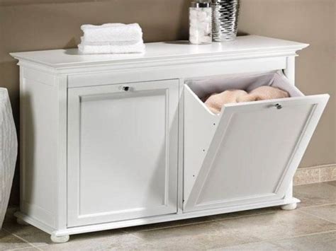 It seems to me like you could put a base cabinet with a shelf (w/o a door) and that would be perfect for holding two laundry baskets ( one on top, one on bottom). 50 Unique Laundry Bags & Baskets To Fit Any Theme