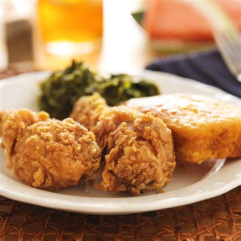 Soul Food Fried Chicken With Collard Greens And Corn Bread Stock