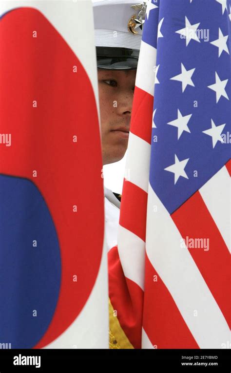 A Member Of An Honour Guard From South Koreas Marine Corps Stands