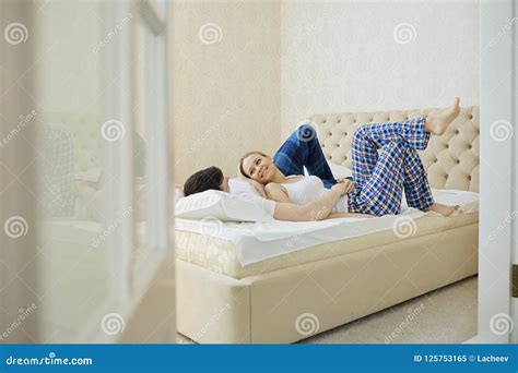 Couple In Bed Hugging In Bedroom Stock Image Image Of Female Relationship 125753165