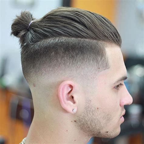Pick out a brand new style for your hair and update your look. 50 Cool Haircuts For Guys: Best Styles For 2021 | Man bun ...