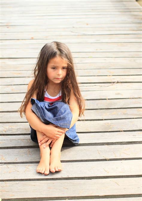Distressed Little Girl Barefoot