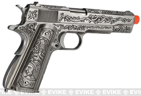La we 1911 è un'elegante opera d'arte con impugnatura magnificamente incisa, telaio e pannelli di aderenza su una finitura in acciaio spazzolato. WE-Tech Full Metal Filigree 1911 Heavy Weight Airsoft Gas ...