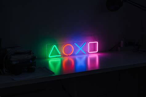 Playstation Ps5 Ps4 Game Console On Table Neon Light Lamp