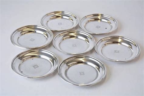 Eight Art Deco Sterling Wine Glass Coasters By Cartier At