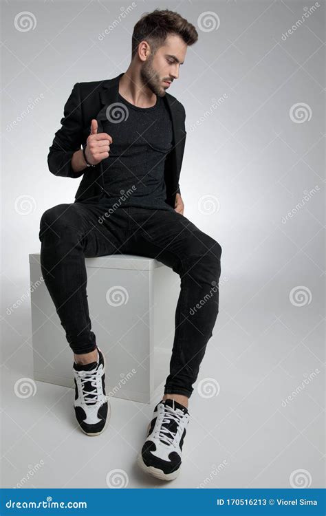 Cool Dramatic Guy Sitting In A Fashion Pose Stock Image Image Of
