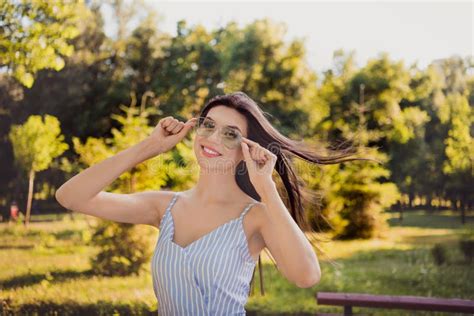 Photo Of Positive Funky Girl With Flying Hair In Sunglass Enjoying Fresh Air Spend Free Time