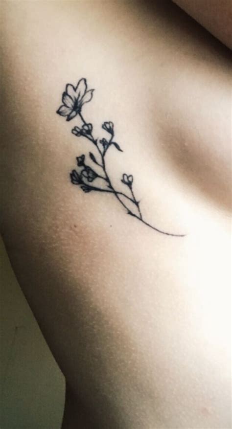 Delicate Flower Rib Tattoo Tattoos For Women Flowers Flower Tattoo On Ribs Small Rib Tattoos