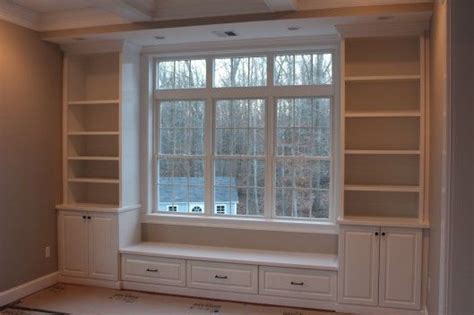 A windowsill bench with a cushion on top and a bookshelf inside it is perfect for a reading nook. Built in Bench & Bookcases » Custom Home Finish | Home ...