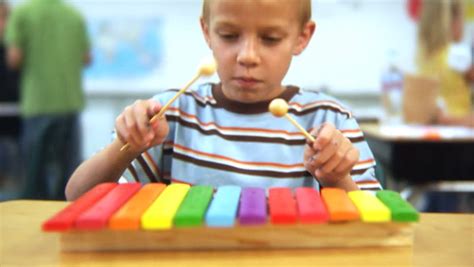 Young Boy Playing Xylophone at Stock Footage Video (100% ...