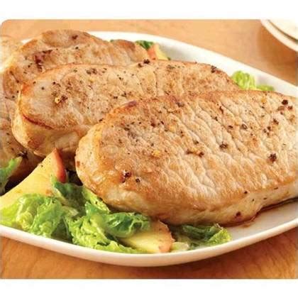 Thick cut pork chops on cast iron skillet (dinner at stone mountain). Pork | Home Delivery | Five Star Home Foods