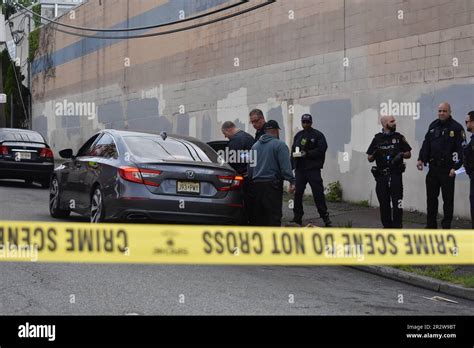 Paterson, United States. 21st May, 2023. EMS and Police officers check