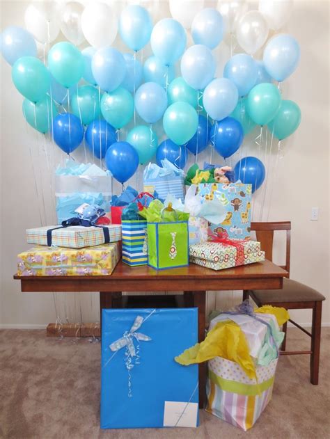 Make sure guests don't forget to hydrate by providing a big cooler of water decorated with a stenciled water. Balloon wall baby shower decorations | Baby shower ...
